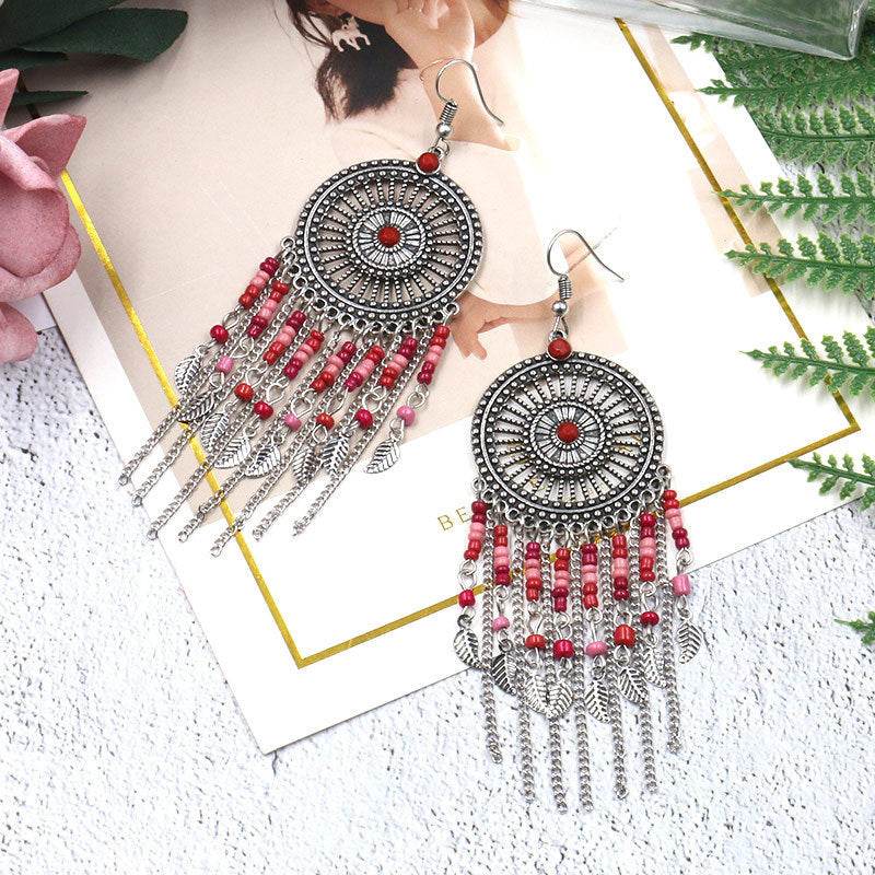 Beaded fringed hollow earrings