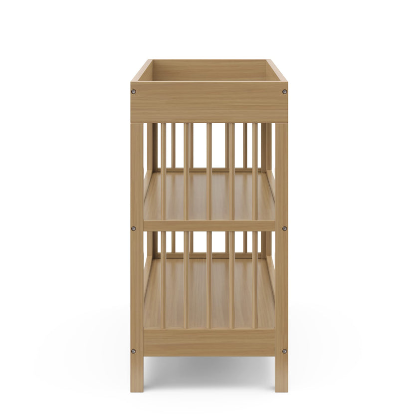 Graco Teddi Changing Table with Water-Resistant Changing Pad (Driftwood) - GREENGUARD Gold Certified, 2 Open Shelves, Includes Bonus Water-Resistant Changing Pad with Safety Strap 🍁 All In One Marketplace Canada