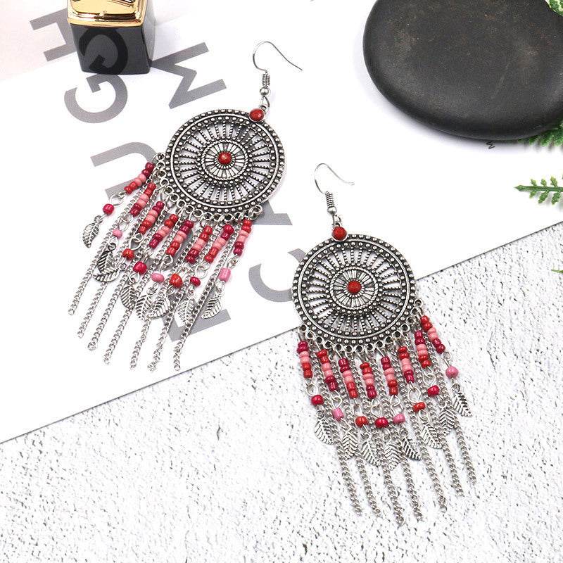 Beaded fringed hollow earrings