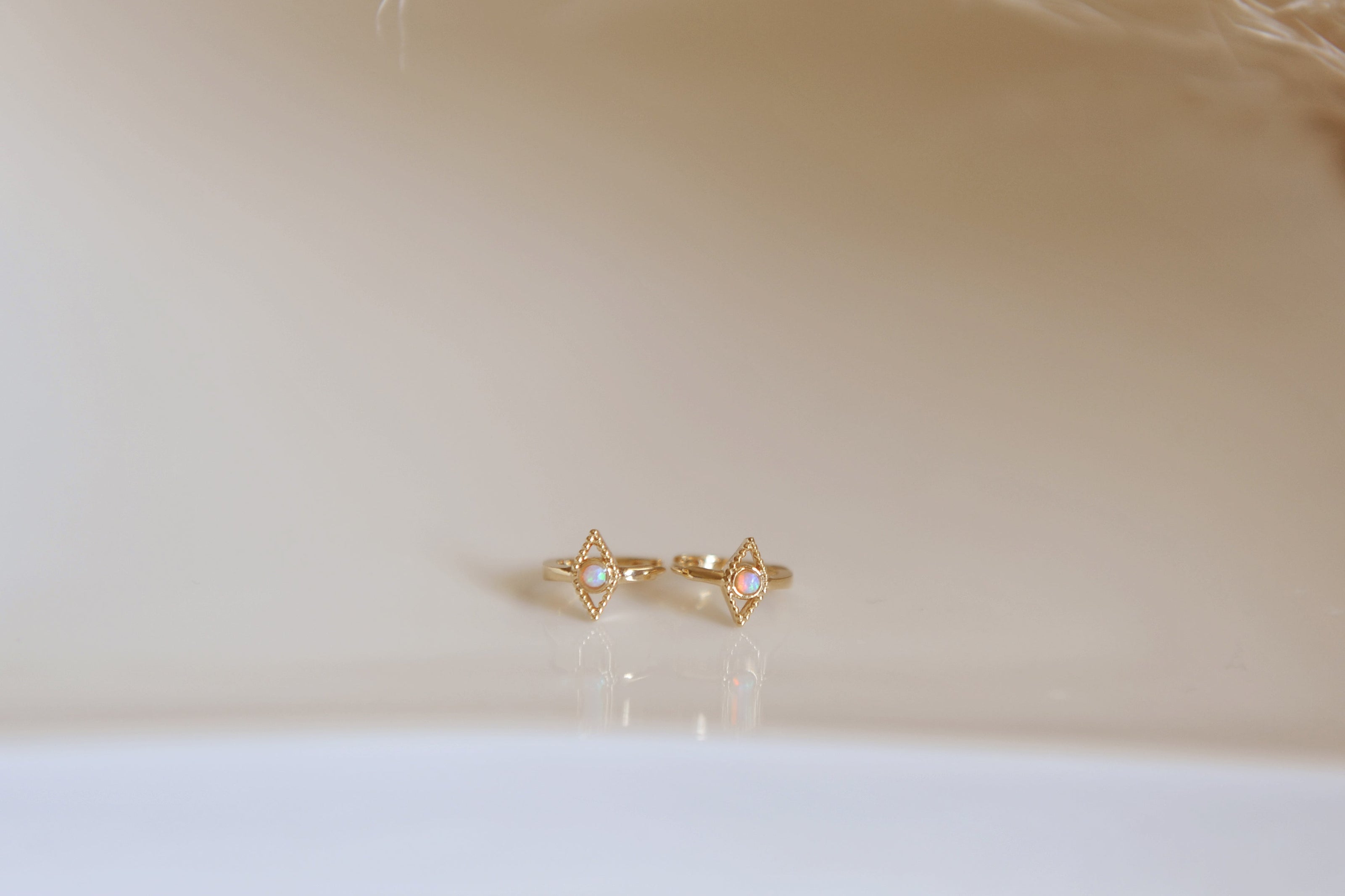 Evil eye opal huggies