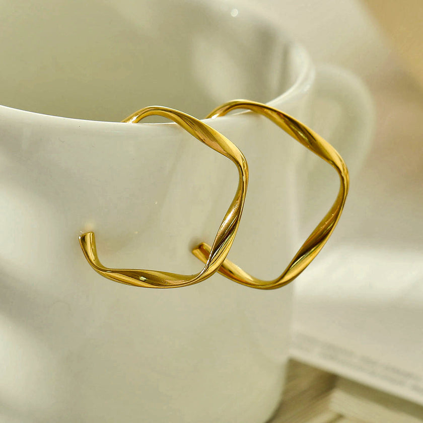 Boucles d'oreilles en forme de sculpture ADAMMA