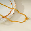 AGULHAS Gold: Celestial Elegance - Snake Skin Chain Necklace with Zirconia Embedded Star Charm