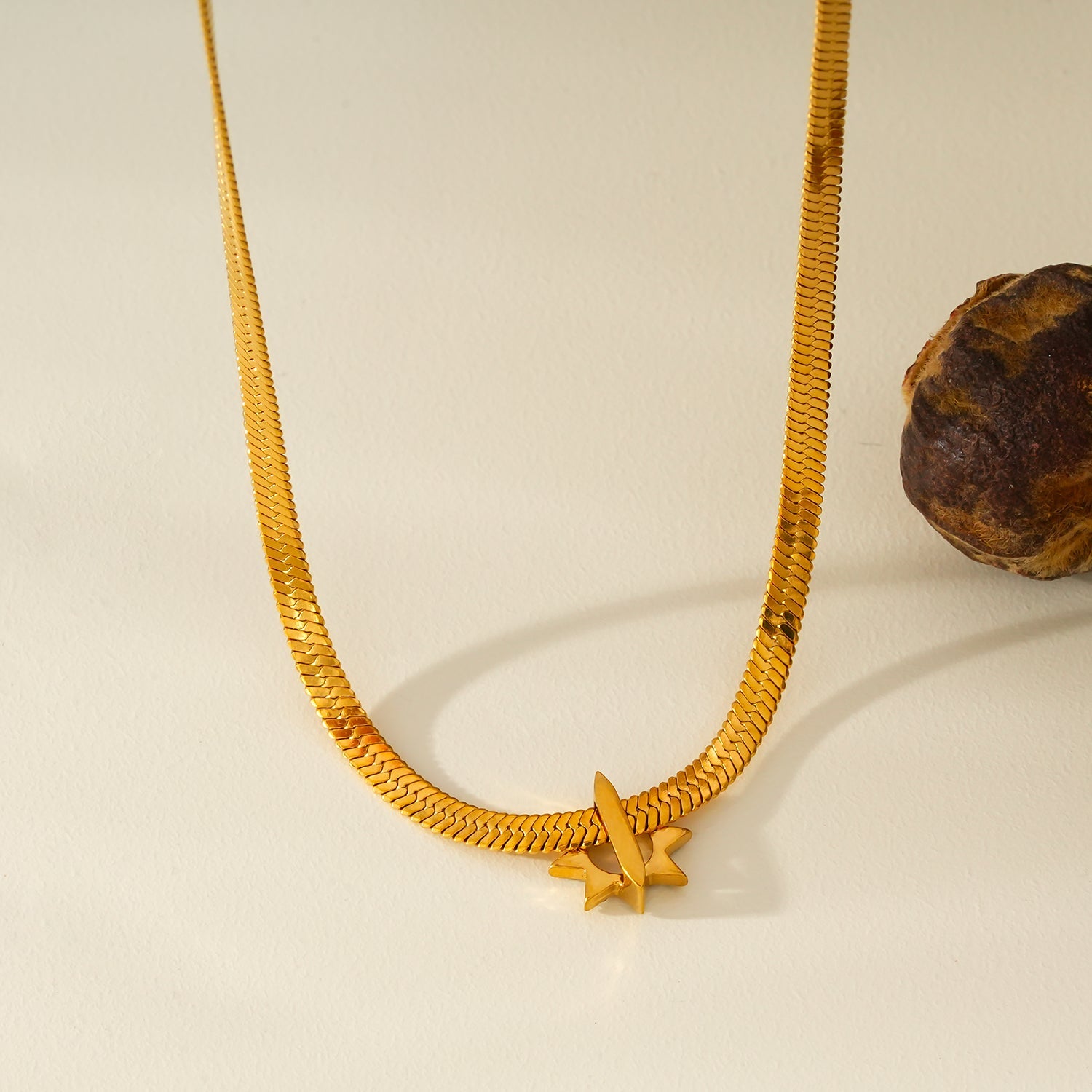 AGULHAS Gold: Celestial Elegance - Snake Skin Chain Necklace with Zirconia Embedded Star Charm
