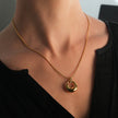 ALBASIMI: Snake Skin Chain with Zirconia (CZ) Embedded Clasp & Asymmetrical Circle Pendent.