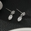 ANDALUSIA : Élégantes boucles d'oreilles pendantes en zircone (CZ) et chaîne en or blanc (ton argenté) – Un éclat intemporel pour toutes les occasions.