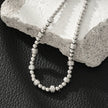Style ANNABETH : Bracelet chaîne en or blanc (couleur argent) avec double perle en fusion.