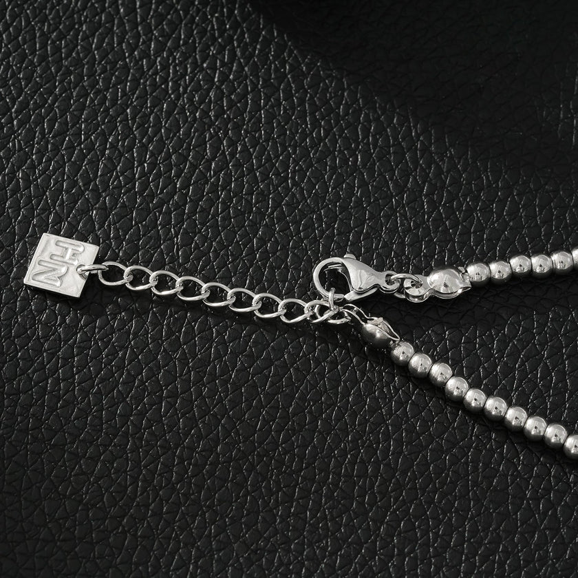 Style ANNABETH : Bracelet chaîne en or blanc (couleur argent) avec double perle en fusion.