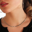 BAMBURG : Collier en chaîne argentée avec motif peau de serpent et étoiles en relief.