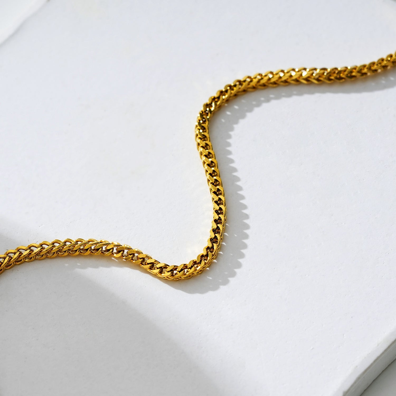 BRIELLA LG : Bracelet de cheville en chaîne cubaine dorée