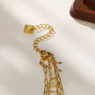 BRONTE : Collier à 2 chaînes superposées avec chaîne minimaliste à maillons plats et chaîne à crochet décorative.