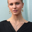 Style BUCKIE : Collier avec plusieurs pendentifs et chaîne en zircone.