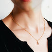 CABBANA Gold:  A Duo Set of Zirconia Charm Pendants on a Beaded Chain Necklace