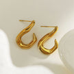 Boucles d'oreilles créoles abstraites en forme de CAGLIO, en or.