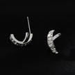 CARBIS: Retro Style Crossover Zirconia Embedded Earrings in White Gold (Silver Toned)