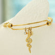 CATALINA Or : Bracelet avec breloques en forme de serpent, symbole solaire et zircone (CZ)