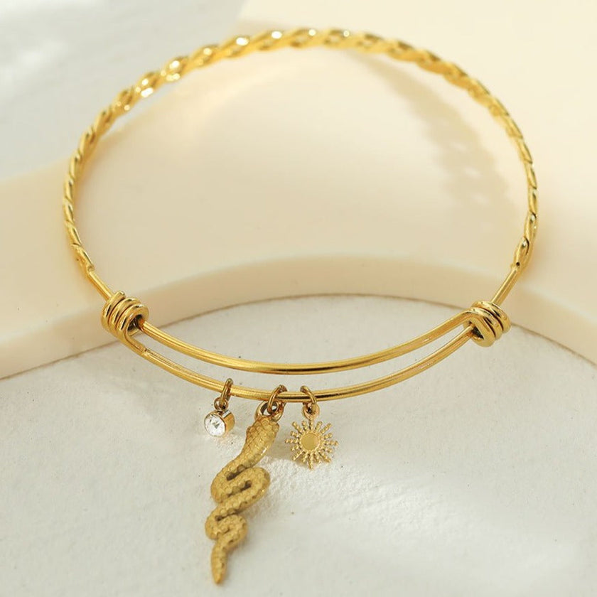 CATALINA Or : Bracelet avec breloques en forme de serpent, symbole solaire et zircone (CZ)