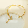CATALINA Or : Bracelet avec breloques en forme de serpent, symbole solaire et zircone (CZ)
