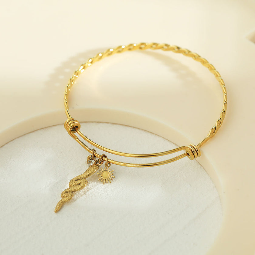 CATALINA Or : Bracelet avec breloques en forme de serpent, symbole solaire et zircone (CZ)