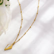 Collier pendentif en forme de diamant minimaliste en métal et coquille de CATORI