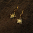 CHARLIE Gold: Semi Hoops with a Sun Symbol Charm