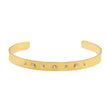 CHIMAKAK : Bracelet en or avec incrustations de zircone et gravure d'étoile.