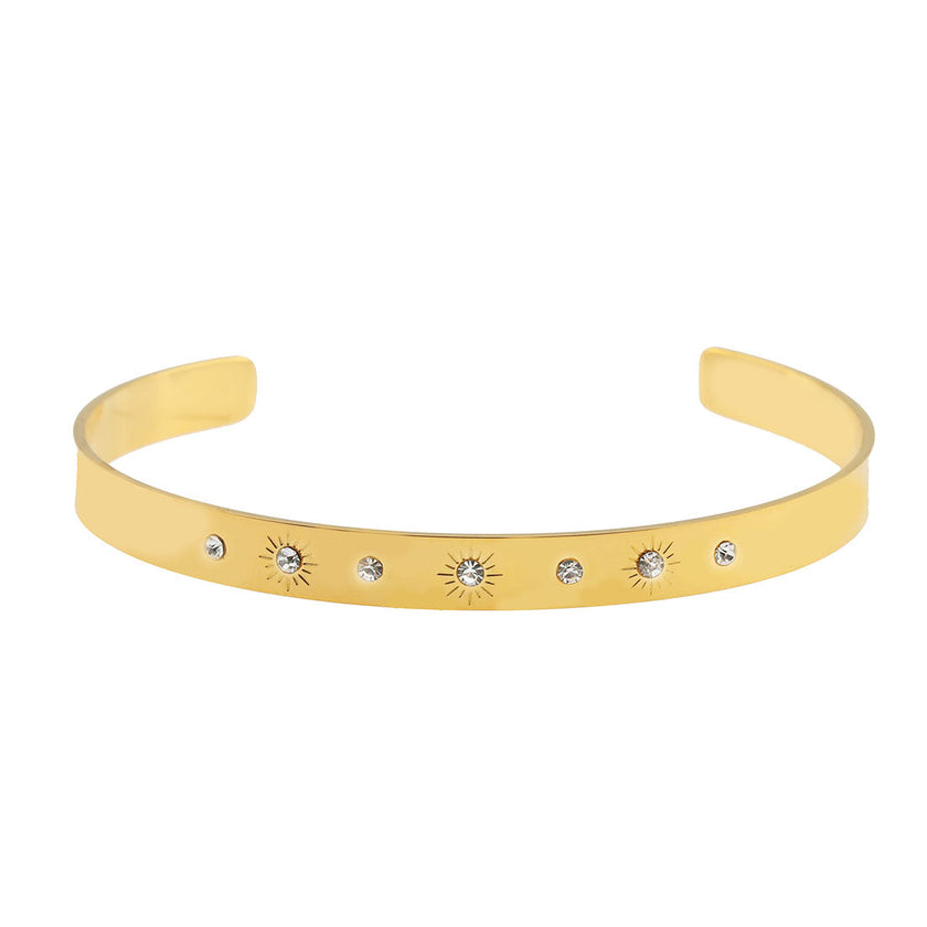 CHIMAKAK : Bracelet en or avec incrustations de zircone et gravure d'étoile.