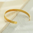 CHIMAKAK : Bracelet en or avec incrustations de zircone et gravure d'étoile.