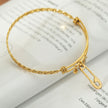 CHRISTINA: Charms Adorned Gold Bracelet