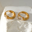 Style CONWYN: Retro Style Hoops with an Encased Clear Zirconia Charm in Gold.