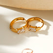 Style CONWYN: Retro Style Hoops with an Encased Clear Zirconia Charm in Gold.