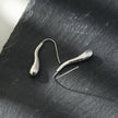 Style CORNING Argent (Or Blanc) : Boucles d'oreilles en forme de têtard – Élégance unique avec une touche ludique.