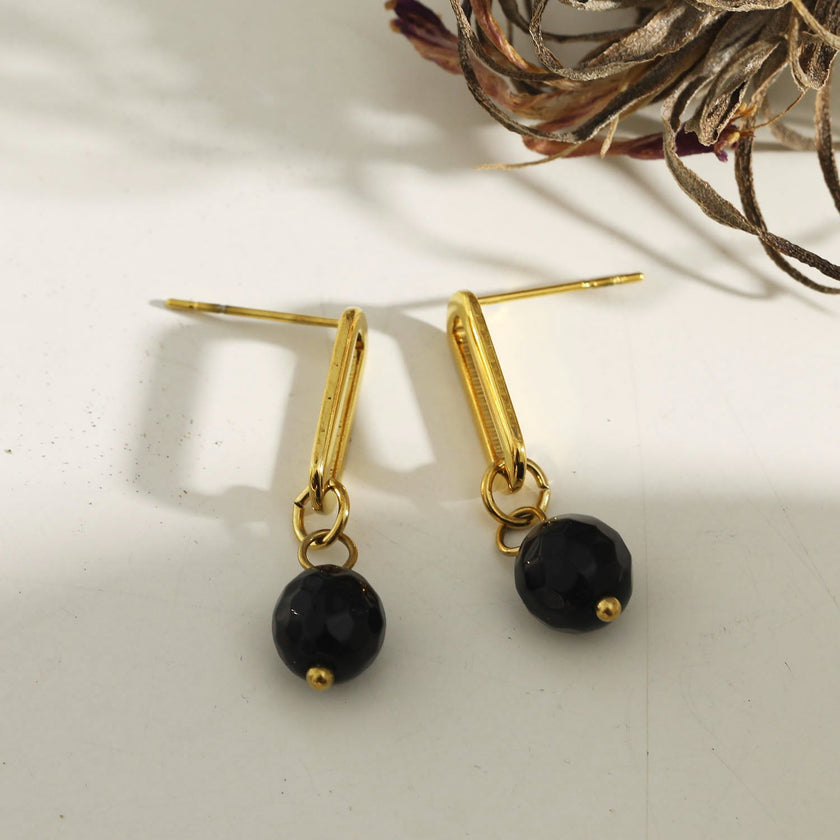 Boucles d'oreilles pendantantes en oxyde de fer noir de DAKATA