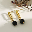 Boucles d'oreilles pendantantes en oxyde de fer noir de DAKATA