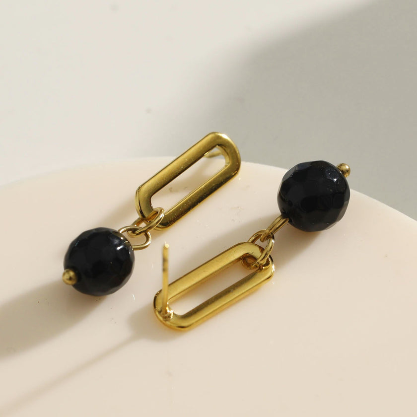 Boucles d'oreilles pendantantes en oxyde de fer noir de DAKATA