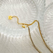 Collier DIANA avec chaîne perlée et détail lariat en zircone pavé.