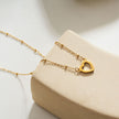 Style CHERISH Or : Chaîne perlée rehaussée d'un élégant pendentif en forme de cœur pavé.