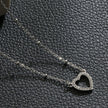 CHERISH Argent (Or Blanc) : Chaîne perlée rehaussant un élégant pendentif en forme de cœur pavé.