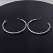 ELNA Silver Hoop Earrings with a Decorative Twist