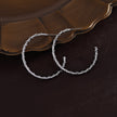 ELNA Silver Hoop Earrings with a Decorative Twist