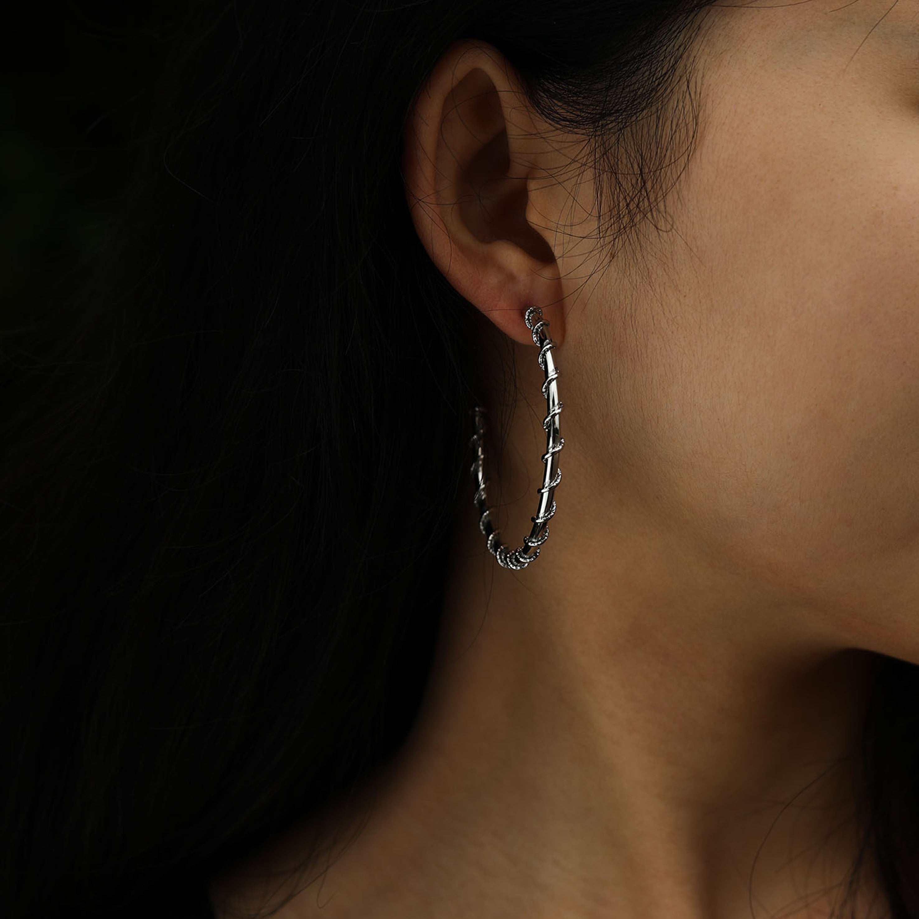 ELNA Silver Hoop Earrings with a Decorative Twist