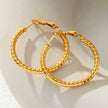 Style ETSUKO : Boucles d'oreilles en forme de cercle avec motif de roseaux sculptés