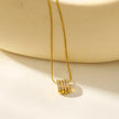 GARNA Gold : Mini chaîne à maillons serpentin ornés de breloques ovales serties de zircons.