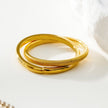 GILBERT : Bague en or à double bande entrelacée, à porter en superposition.