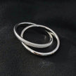 GILBERT : Bague à porter en superposition, double bande entrelacée, en or blanc (ton argenté)