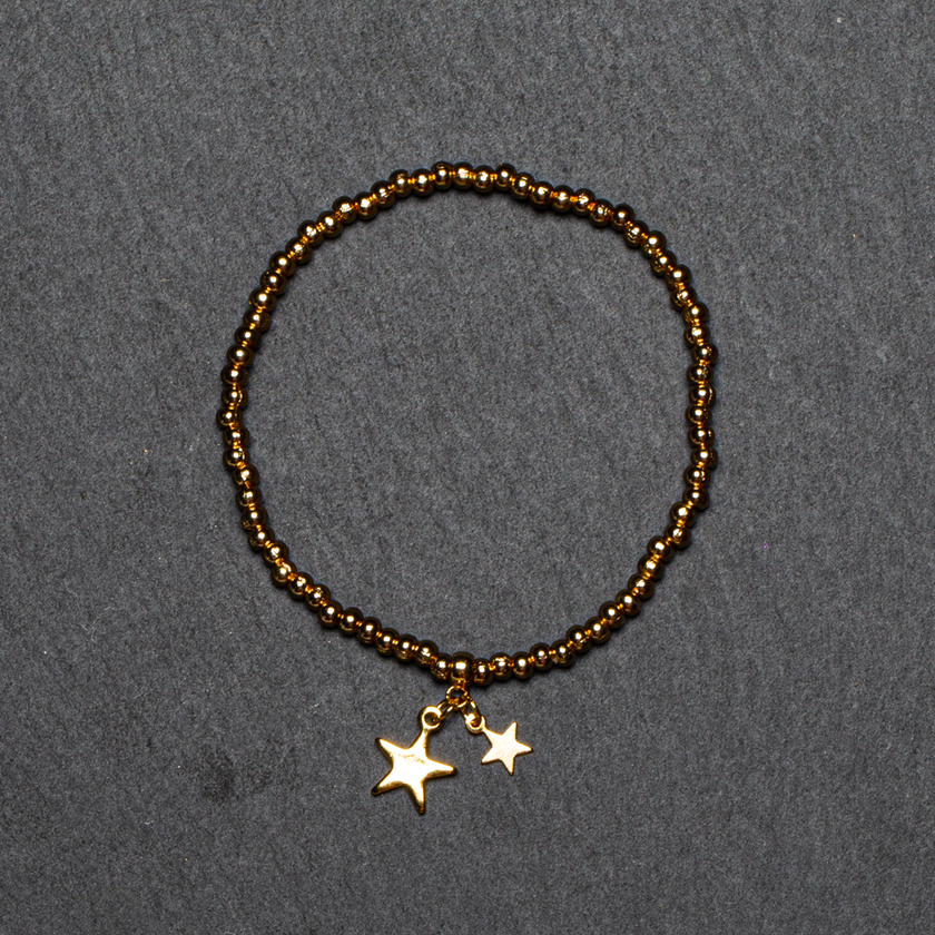 Elasticated Star Charm Bracelet In Gold Plate