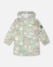 Green raincoat with color-changing frogs