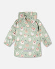 Green raincoat with color-changing frogs