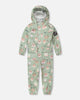 Green rain jumpsuit with color-changing frogs print