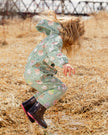 Green rain jumpsuit with color-changing frogs print
