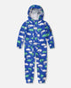 Blue rain jumpsuit with color-changing chameleon print